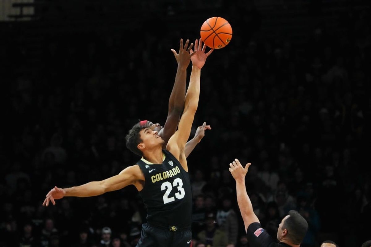 Jan 13, 2024; Boulder, Colorado, USA; USC Trojans forward Vincent Iwuchukwu (3) and Colorado Buffaloes forward Tristan da Silva (23) reach for the tip off in the first half at the CU Events Center.