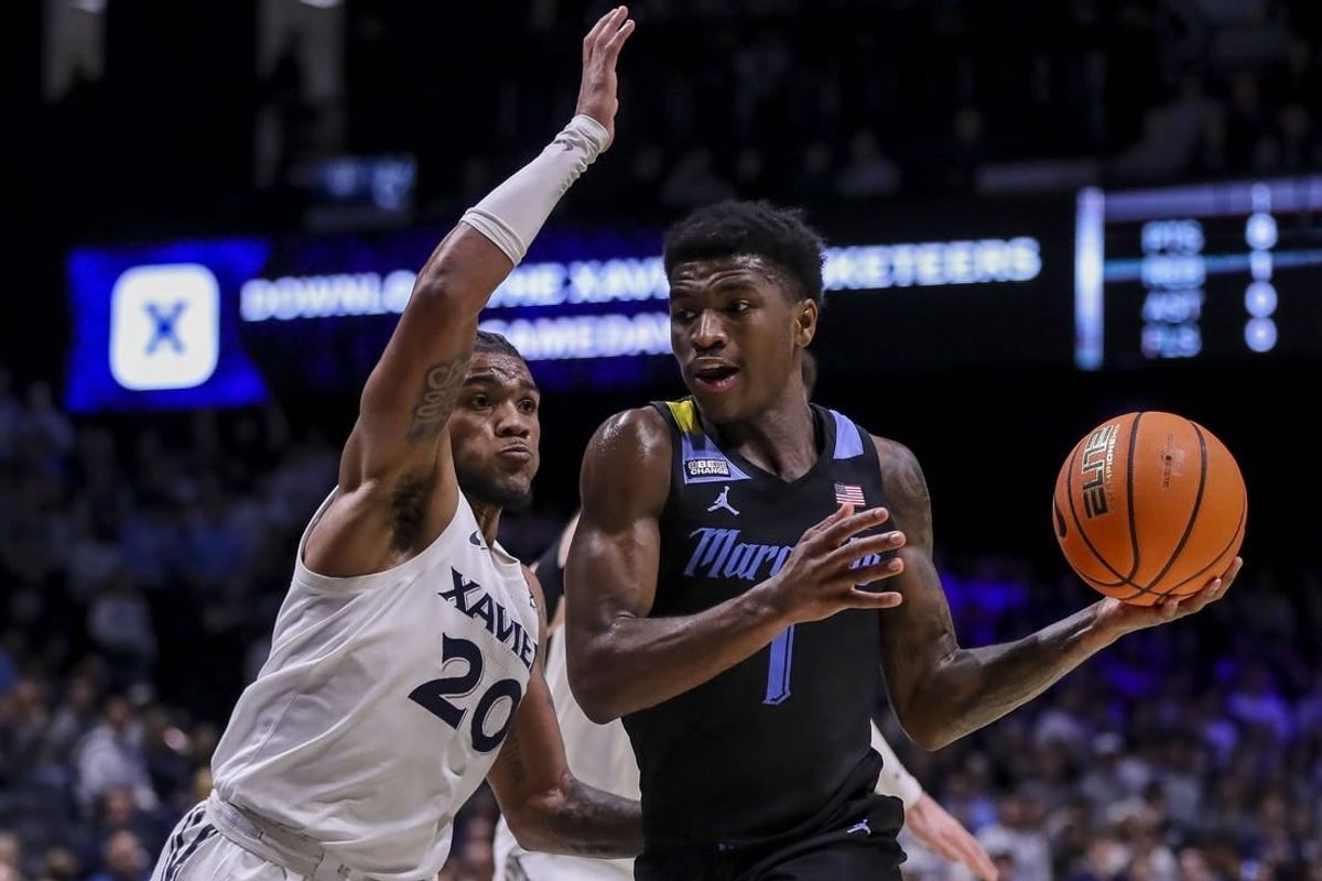 Mar 9, 2024; Cincinnati, Ohio, USA; Marquette Golden Eagles guard Kam Jones (1) dribbles against Xavier Musketeers guard Dayvion McKnight (20) in the first half at Cintas Center.