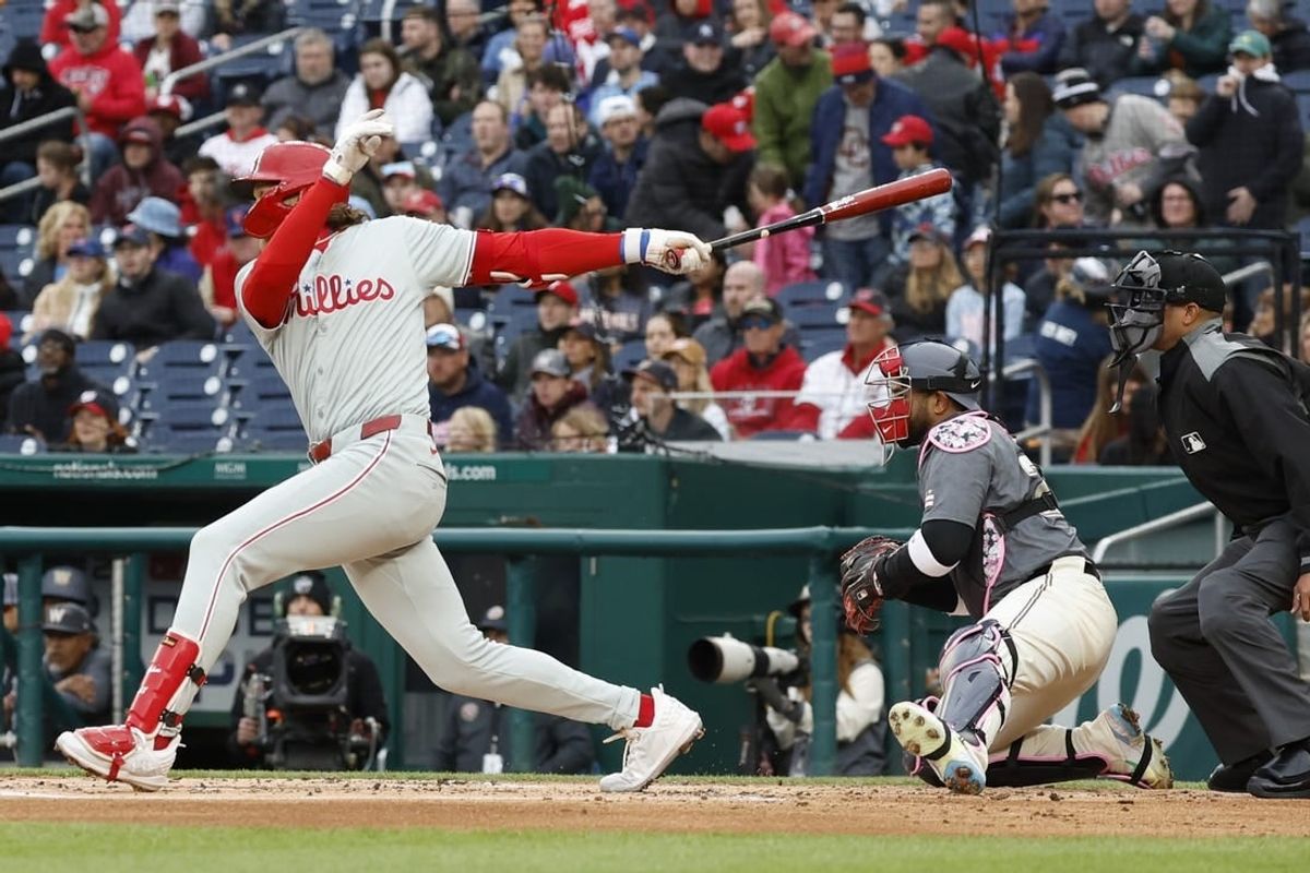 Apr 6, 2024; Washington, District of Columbia, USA; Philadelphia Phillies third base Alec Bohm (28) hits an RBI triple against the Washington Nationals during the second inning at Nationals Park.