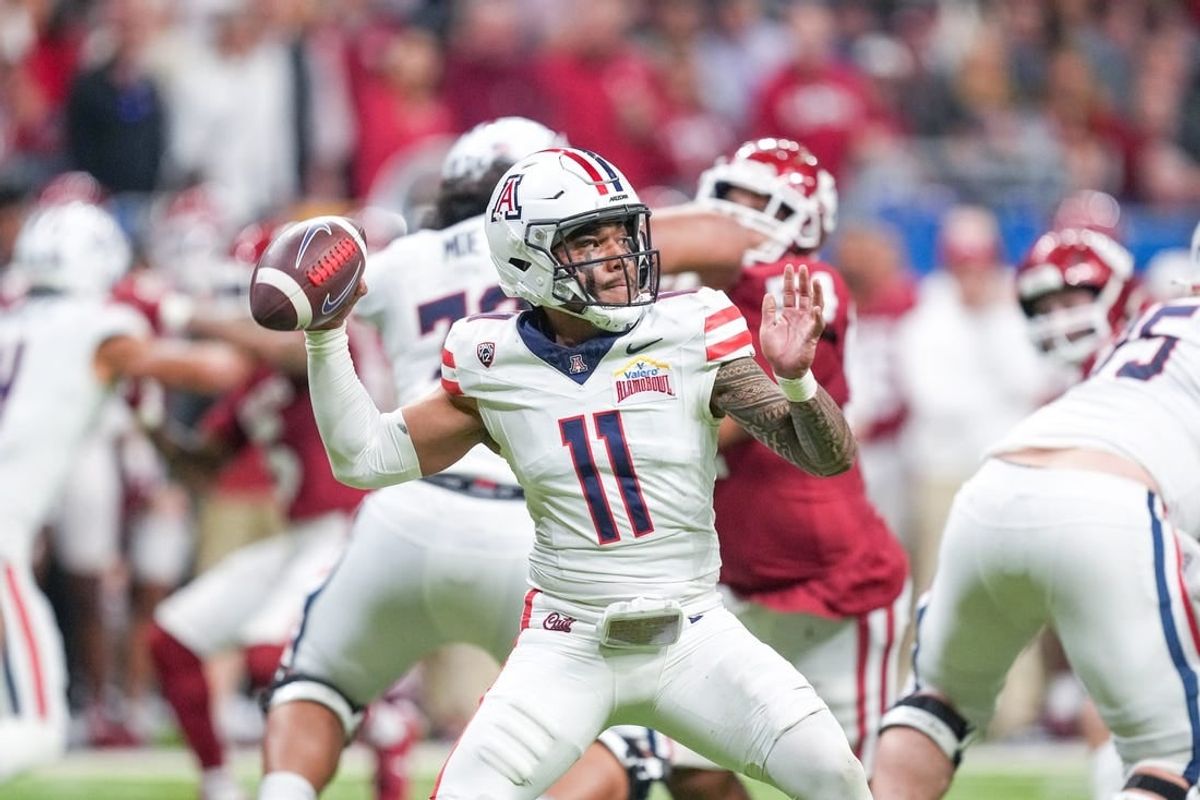 Dec 28, 2023; San Antonio, TX, USA;  Arizona Wildcats quarterback Noah Fifita (11) throws a pass in the first half against the Oklahoma Sooners at Alamodome.