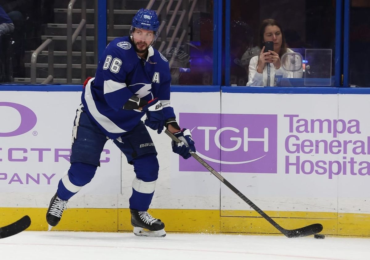 Nov 30, 2023; Tampa, Florida, USA; Tampa Bay Lightning right wing Nikita Kucherov (86) passes the puck against the Pittsburgh Penguins during the first period at Amalie Arena.
