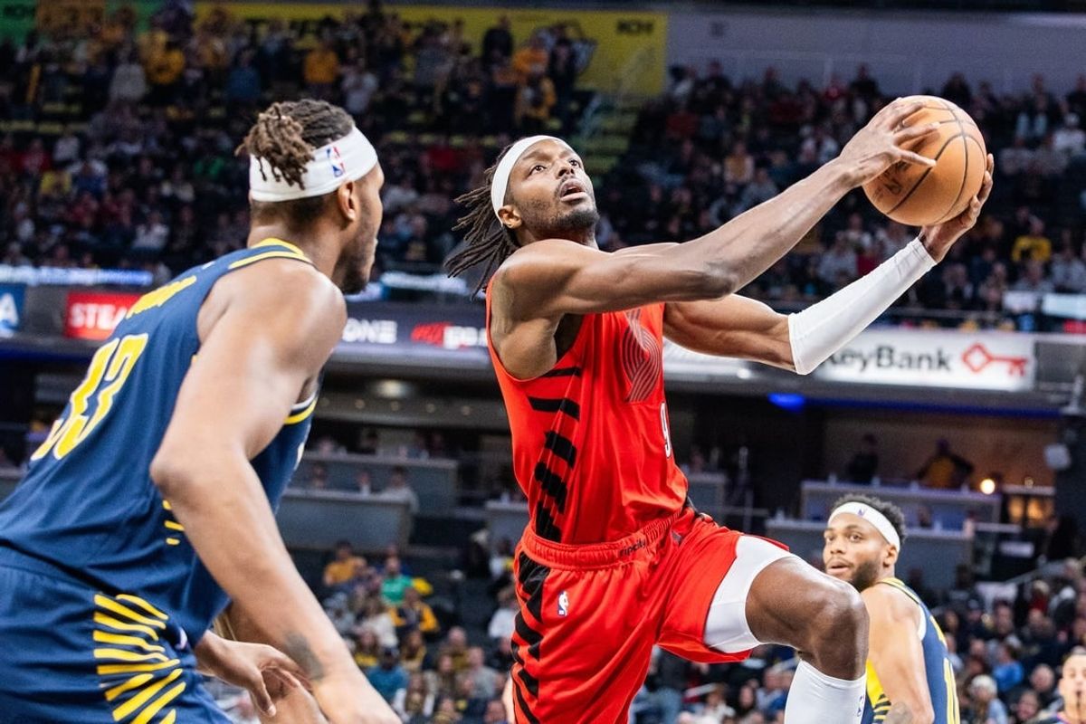 Nov 27, 2023; Indianapolis, Indiana, USA; Portland Trail Blazers forward Jerami Grant (9) shoots the ball while Indiana Pacers center Myles Turner (33)  defends in the second quarter at Gainbridge Fieldhouse.