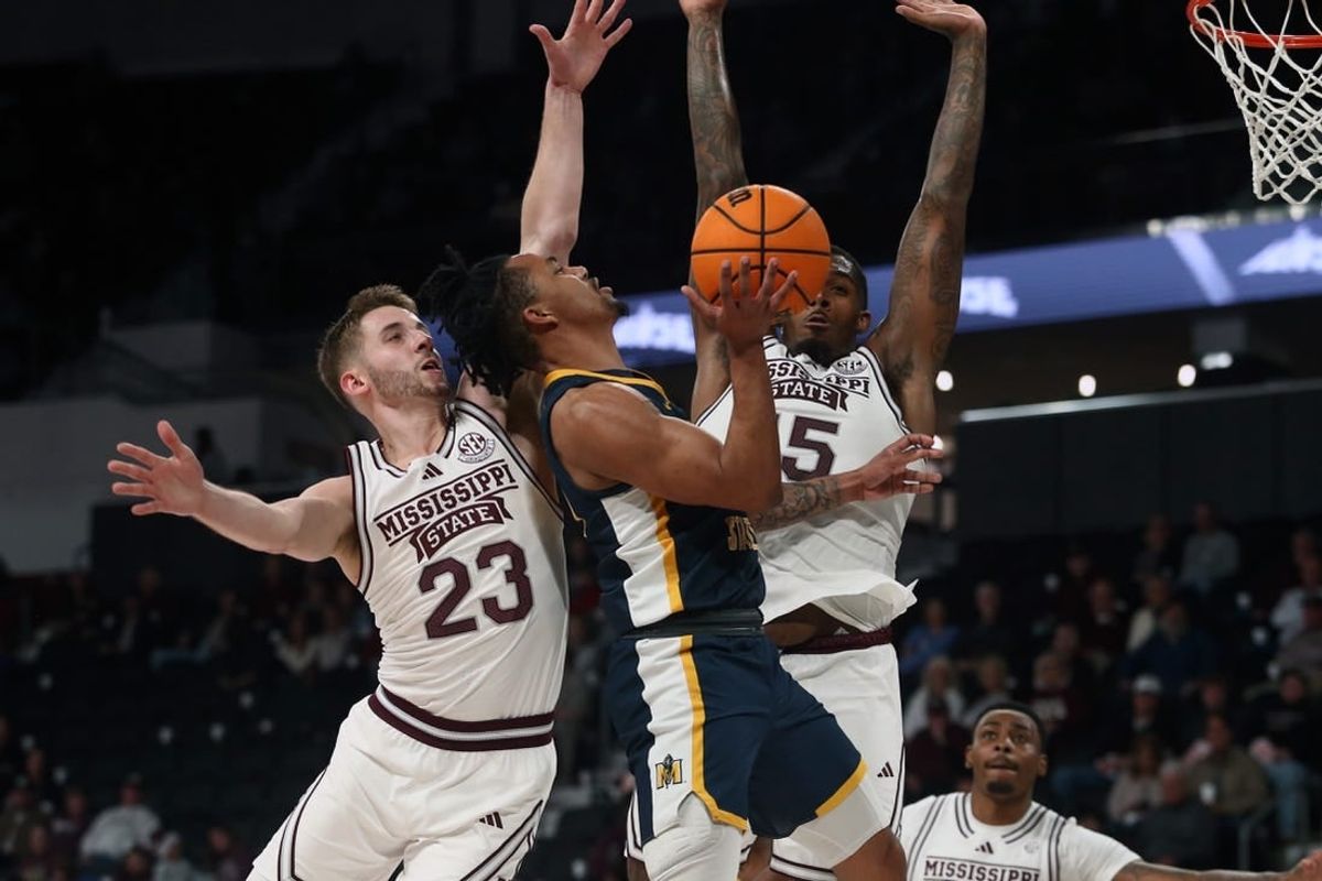 Dec 13, 2023; Starkville, Mississippi, USA; Murray State Racers guard JaCobi Wood (24) drives to the basket as Mississippi State Bulldogs guard Andrew Taylor (23) and forward Jimmy Bell Jr. (15) defends during the first half at Humphrey Coliseum.