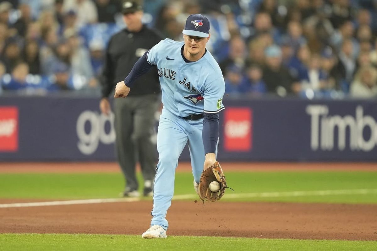 Sep 28, 2023; Toronto, Ontario, CAN; Toronto Blue Jays third baseman Matt Chapman (26) fields a ground ball hit by New York Yankees left fielder Oswaldo Cabrera (not pictured) during the ninth inning at Rogers Centre.
