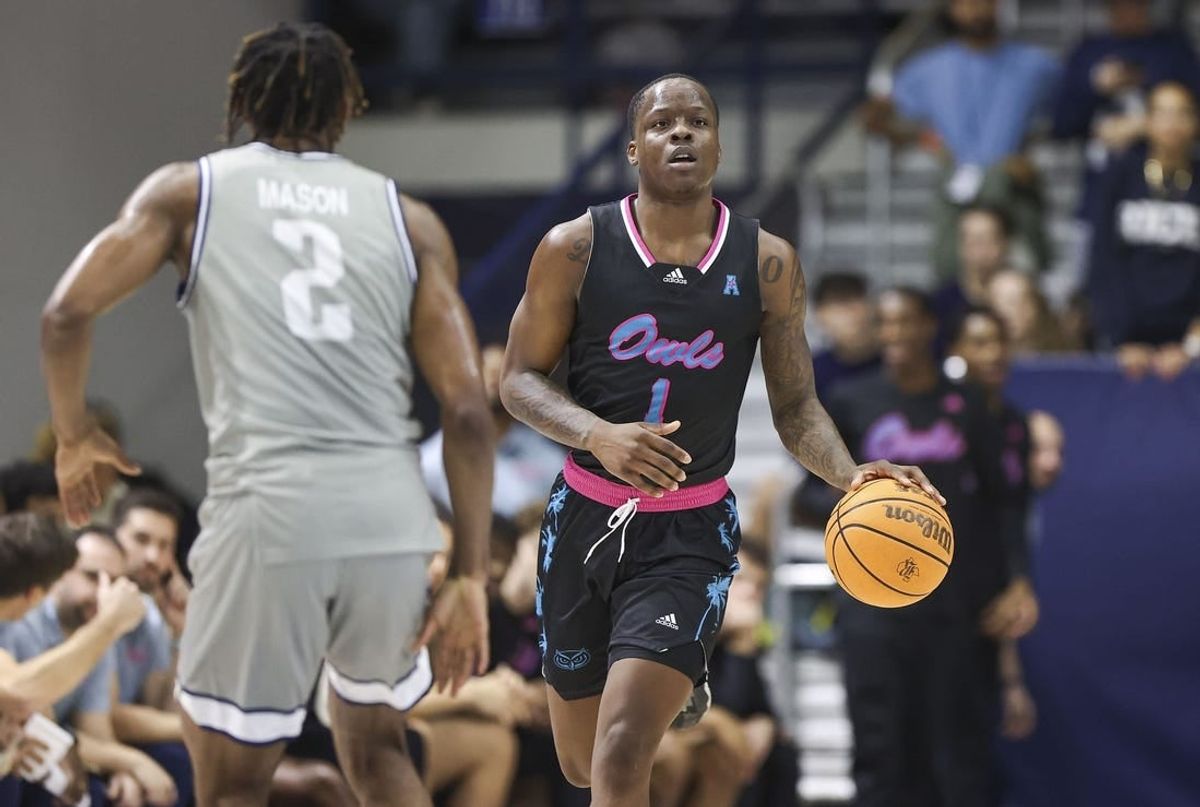 Jan 24, 2024; Houston, Texas, USA; Florida Atlantic Owls guard Johnell Davis (1) brings the ball up the court as Rice Owls guard Mekhi Mason (2) defends during the first half at Tudor Fieldhouse.
