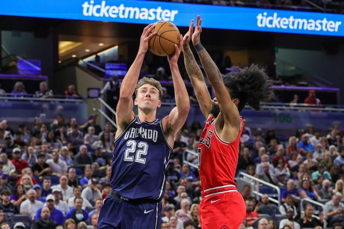 Apr 7, 2024; Orlando, Florida, USA; Orlando Magic forward Franz Wagner (22) goes to the basket in front of Chicago Bulls guard Coby White (0) during the second quarter at KIA Center.