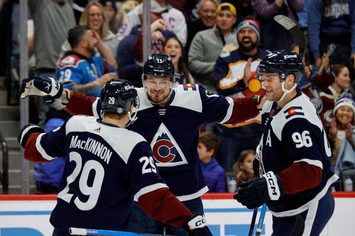 Dec 23, 2023; Denver, Colorado, USA; Colorado Avalanche right wing Valeri Nichushkin (13) celebrates his goal with center Nathan MacKinnon (29) and right wing Mikko Rantanen (96) in the second period against the Arizona Coyotes at Ball Arena.