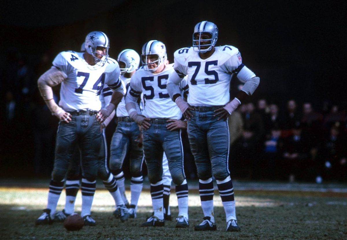 Nov 16, 1969; Washington, DC, USA; FILE PHOTO; Dallas Cowboys defensive end Jethro Pugh (75), Bob Lilly (74), and Lee Roy Jordan (55) against the Washington Redskins at RFK Stadium. Mandatory Credit: Dick Raphael-Imagn Images
