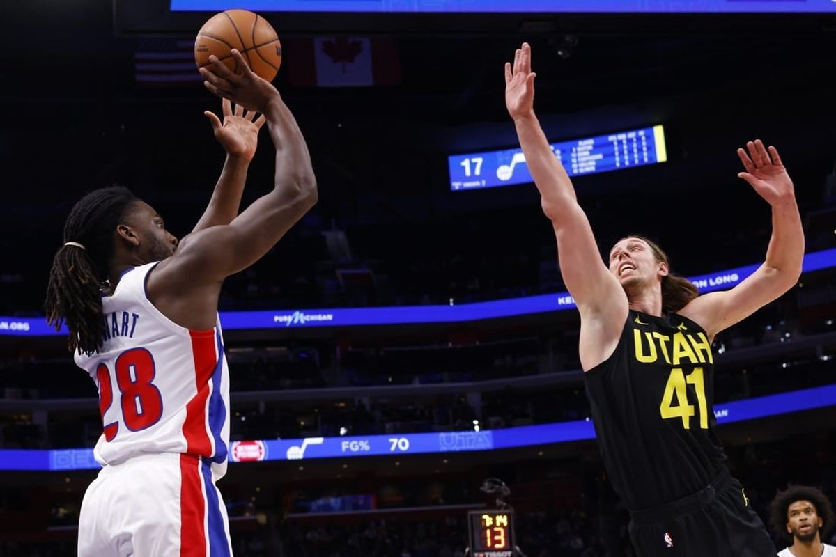 Dec 21, 2023; Detroit, Michigan, USA;  Detroit Pistons center Isaiah Stewart (28) shoots on Utah Jazz forward Kelly Olynyk (41) in the first half at Little Caesars Arena.