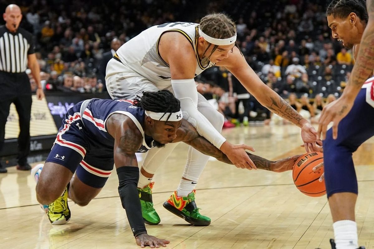 Nov 19, 2023; Columbia, Missouri, USA; Missouri Tigers forward Noah Carter (35) and Jackson State Tigers forward Jordan O'Neal (23) and guard Chase Adams (10) fight for a loose ball during the first half at Mizzou Arena.