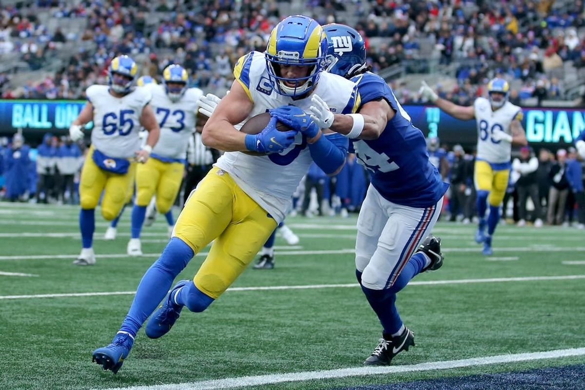 Dec 31, 2023; East Rutherford, New Jersey, USA; Los Angeles Rams wide receiver Cooper Kupp (10) scores a touchdown against New York Giants cornerback Nick McCloud (44) during the second quarter at MetLife Stadium.