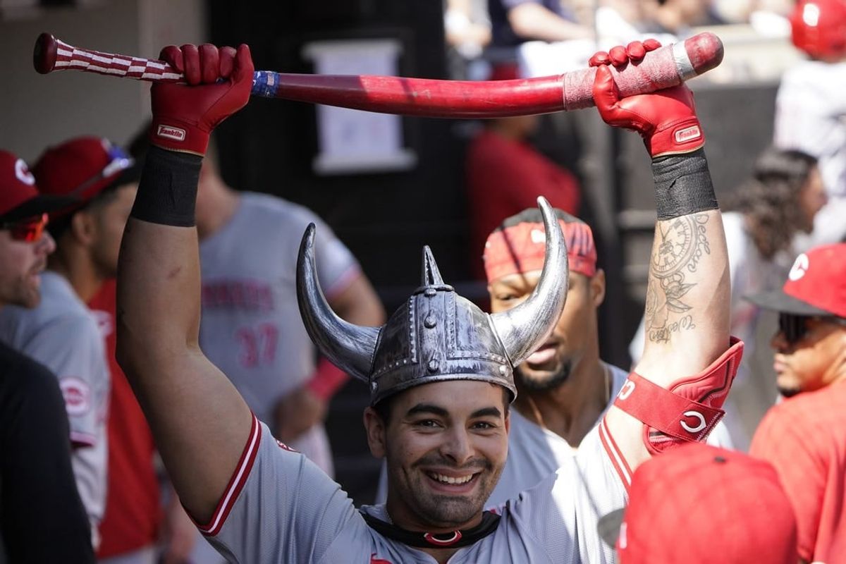 Apr 14, 2024; Chicago, Illinois, USA; Cincinnati Reds first base Christian Encarnacion-Strand (33) is greeted in the dugout after hitting a two-run home run against the Chicago White Sox during the third inning at Guaranteed Rate Field.