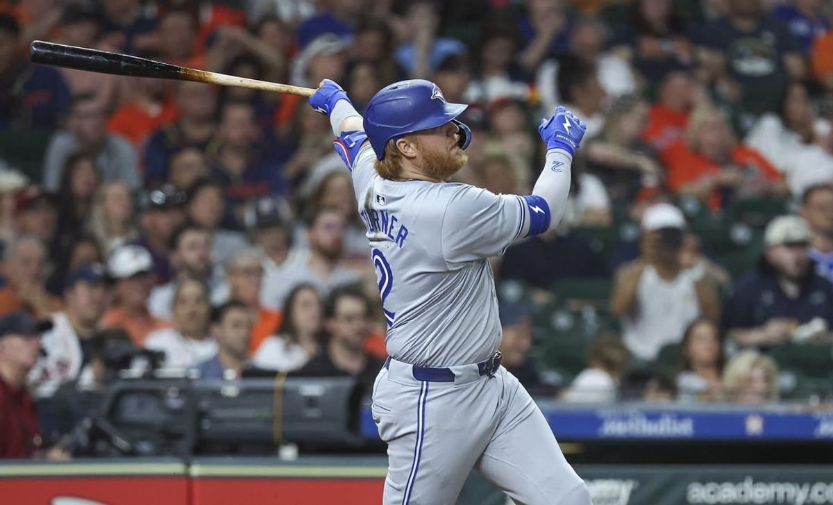 Apr 2, 2024; Houston, Texas, USA; Toronto Blue Jays designated hitter Justin Turner (2) hits a single during the seventh inning against the Houston Astros at Minute Maid Park.
