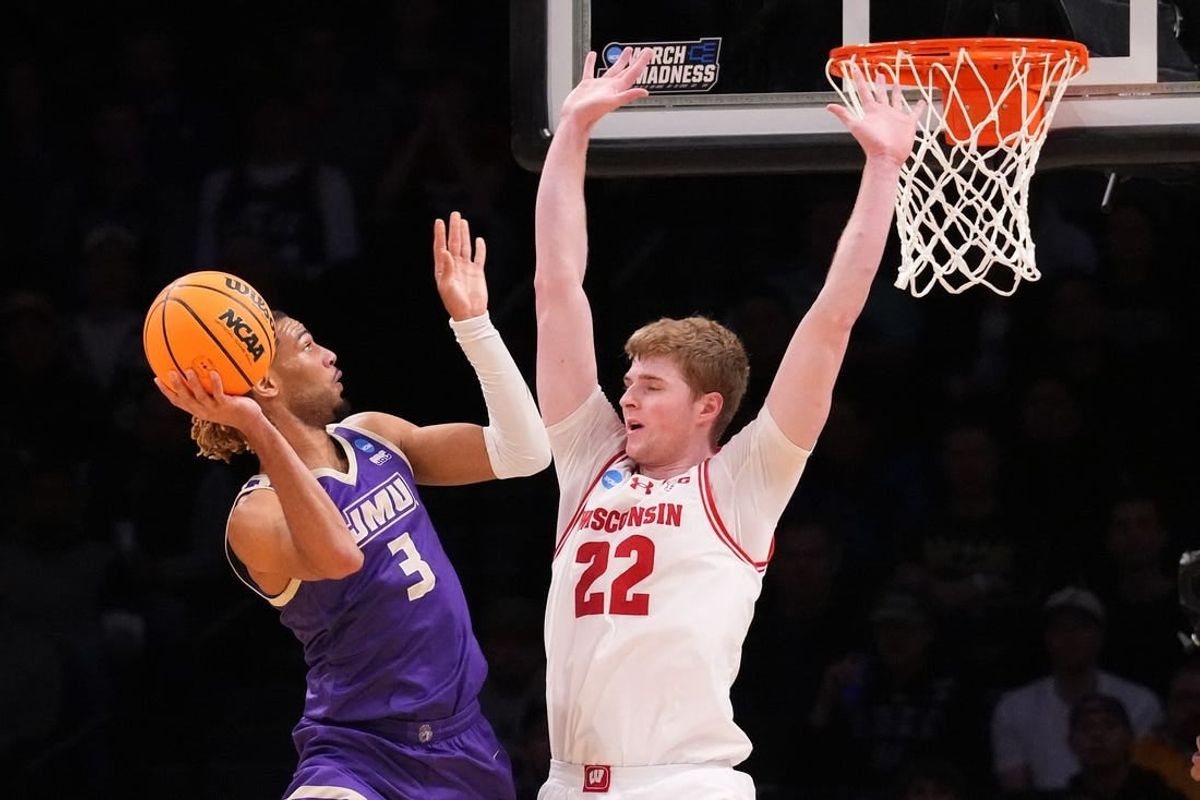 Mar 22, 2024; Brooklyn, NY, USA; James Madison Dukes forward T.J. Bickerstaff (3) shoots the ball over Wisconsin Badgers forward Steven Crowl (22) in the first round of the 2024 NCAA Tournament at the Barclays Center.