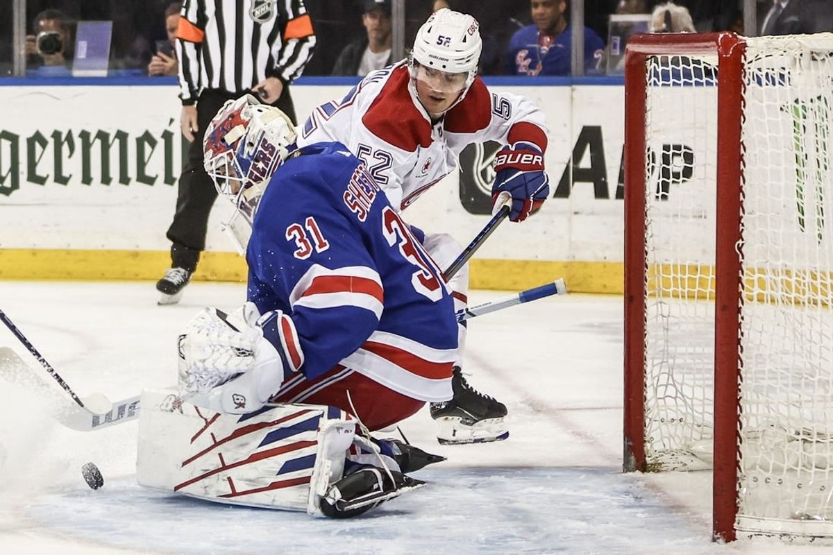 Apr 7, 2024; New York, New York, USA;  New York Rangers goaltender Igor Shesterkin (31) makes a save on a shot on goal attempt by Montreal Canadiens defenseman Justin Barron (52) in the first period at Madison Square Garden.