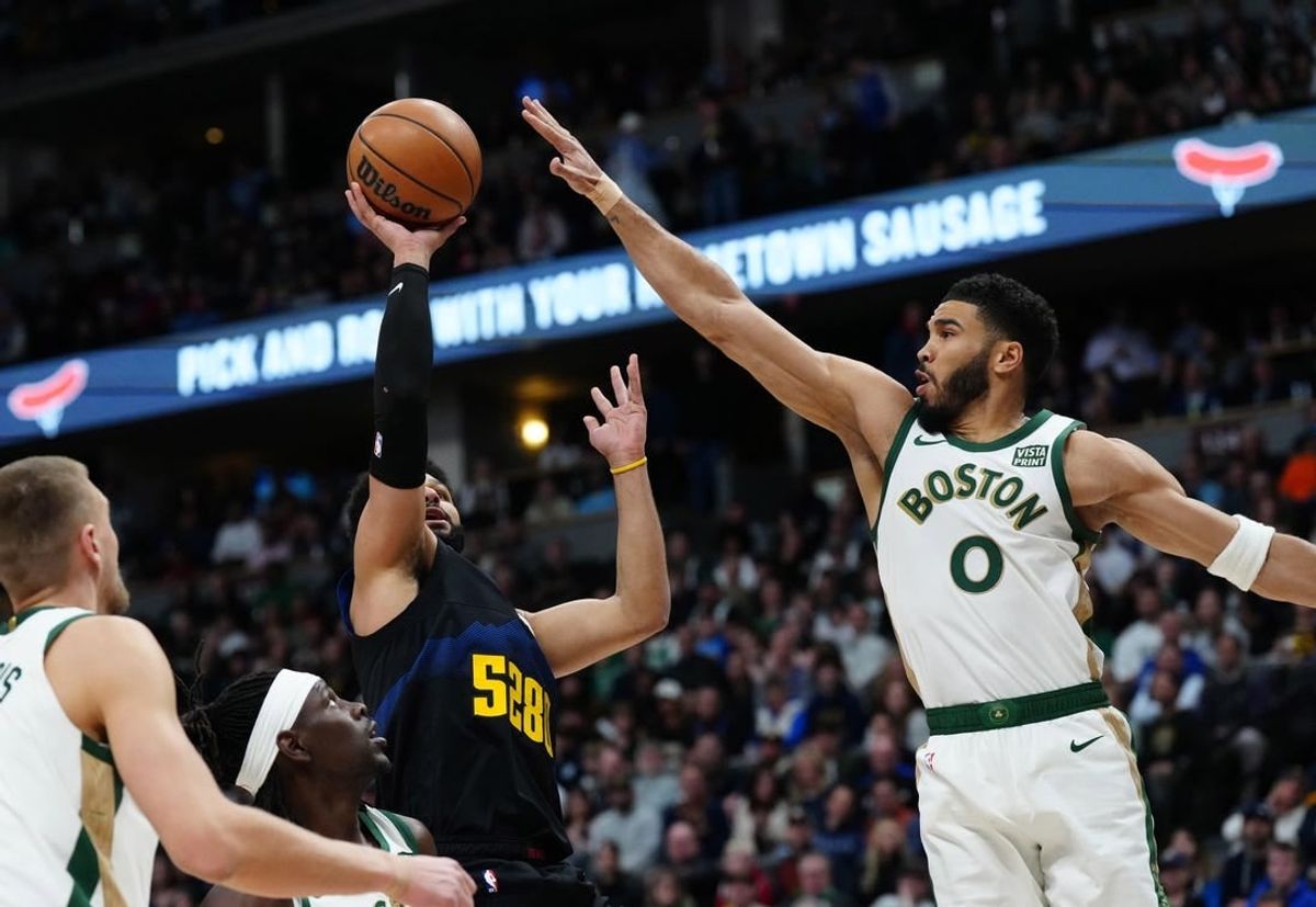 Mar 7, 2024; Denver, Colorado, USA; Denver Nuggets guard Jamal Murray (27) shoots the ball at Boston Celtics forward Jayson Tatum (0) in the first quarter at Ball Arena.
