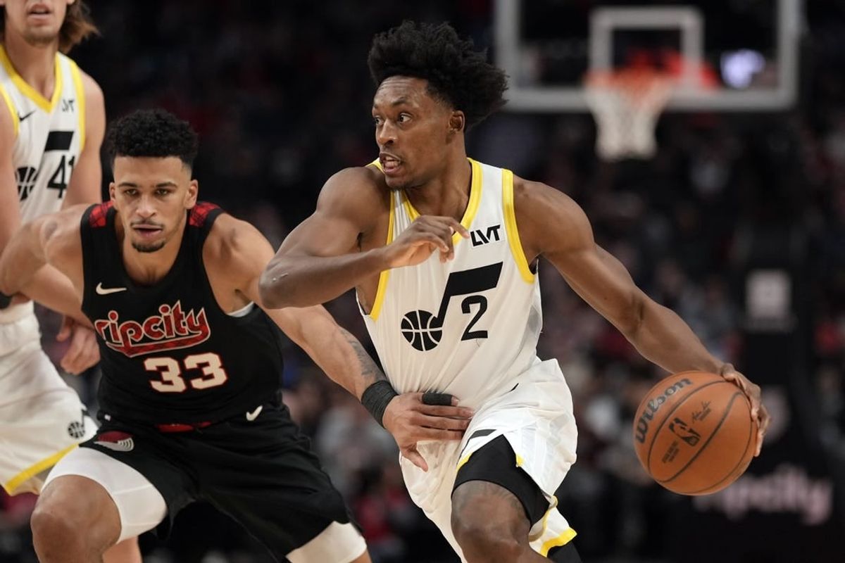 Dec 14, 2023; Portland, Oregon, USA; Utah Jazz point guard Collin Sexton (2) dribbles the ball while defended by Portland Trail Blazers forward Toumani Camara (33) during the first half at Moda Center.