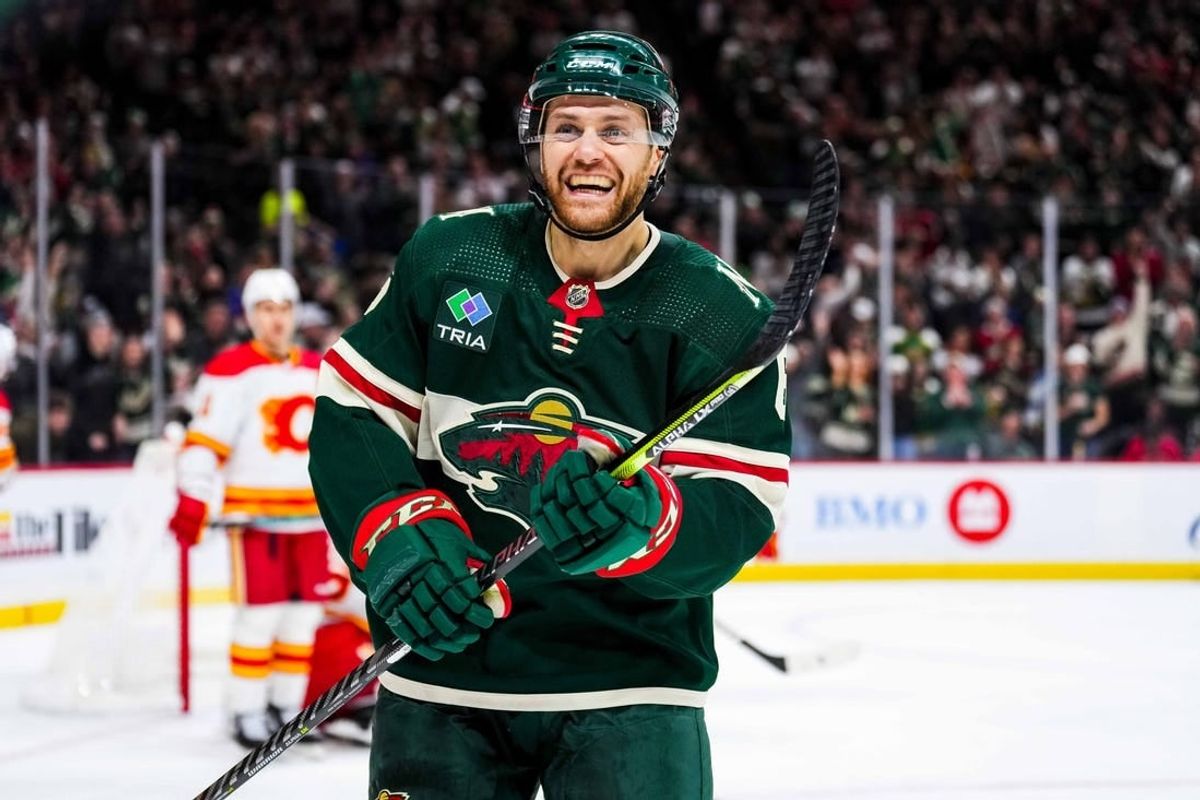 Jan 2, 2024; Saint Paul, Minnesota, USA; Minnesota Wild defenseman Dakota Mermis (6) celebrates a goal scored by left wing Pat Maroon (not pictured) during the second period against the Calgary Flames at Xcel Energy Center.