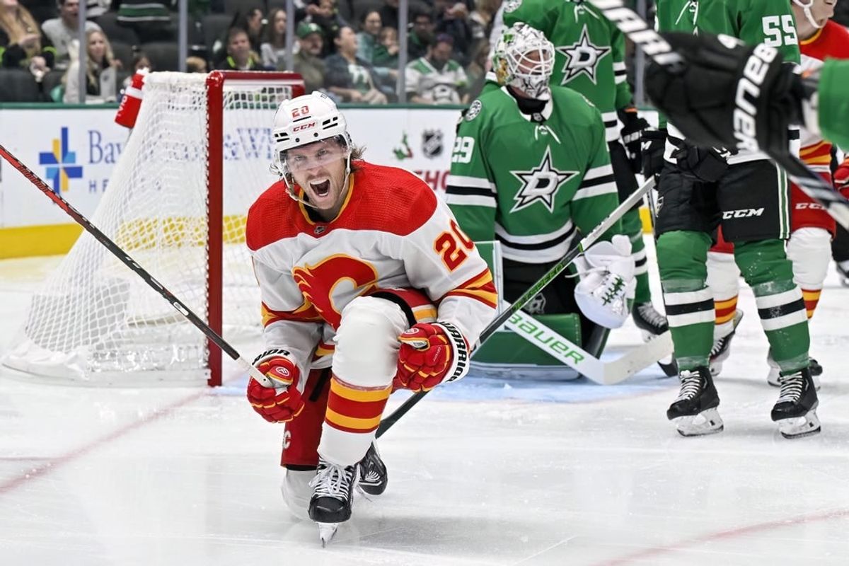 Nov 24, 2023; Dallas, Texas, USA; Calgary Flames center Blake Coleman (20) celebrates after scoring a goal against Dallas Stars goaltender Jake Oettinger (29) during the third period at the American Airlines Center.
