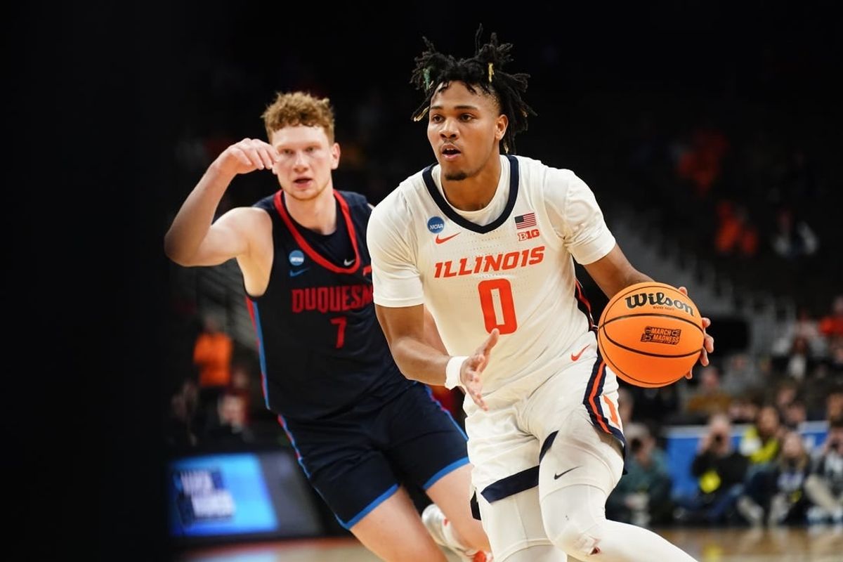 Mar 23, 2024; Omaha, NE, USA; Illinois Fighting Illini guard Terrence Shannon Jr. (0) dribbles the ball against Duquesne Dukes forward Jake Necas (7) during the second half in the second round of the 2024 NCAA Tournament at CHI Health Center Omaha.