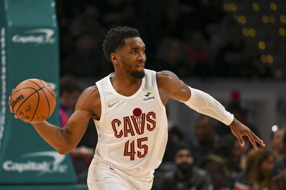 Feb 25, 2024; Washington, District of Columbia, USA;  Cleveland Cavaliers guard Donovan Mitchell (45) passes up the court during the first half against the Washington Wizards at Capital One Arena.