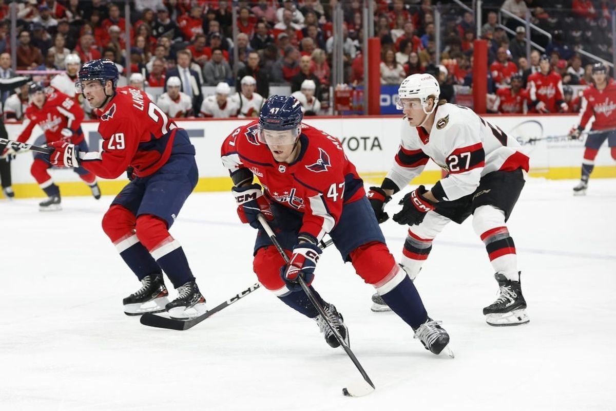 Feb 26, 2024; Washington, District of Columbia, USA; Washington Capitals left wing Beck Malenstyn (47) skates with the puck as Ottawa Senators left wing Parker Kelly (27) chases in the first period at Capital One Arena.
