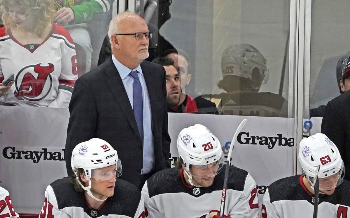 Nov 5, 2023; Chicago, Illinois, USA; New Jersey Devils head coach Lindy Ruff stands behind the bench during the first period at United Center.