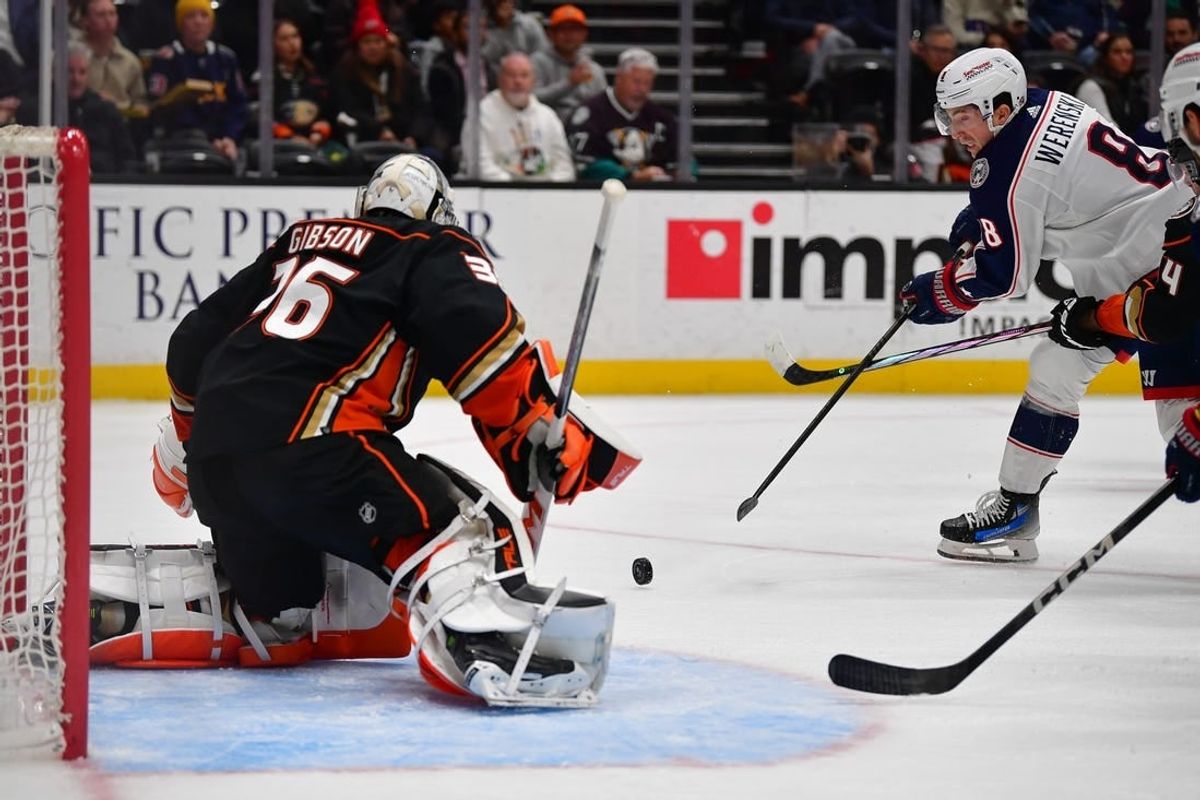 Feb 21, 2024; Anaheim, California, USA; Columbus Blue Jackets defenseman Zach Werenski (8) moves in for a shot on goal against Anaheim Ducks goaltender John Gibson (36) during the second period at Honda Center.