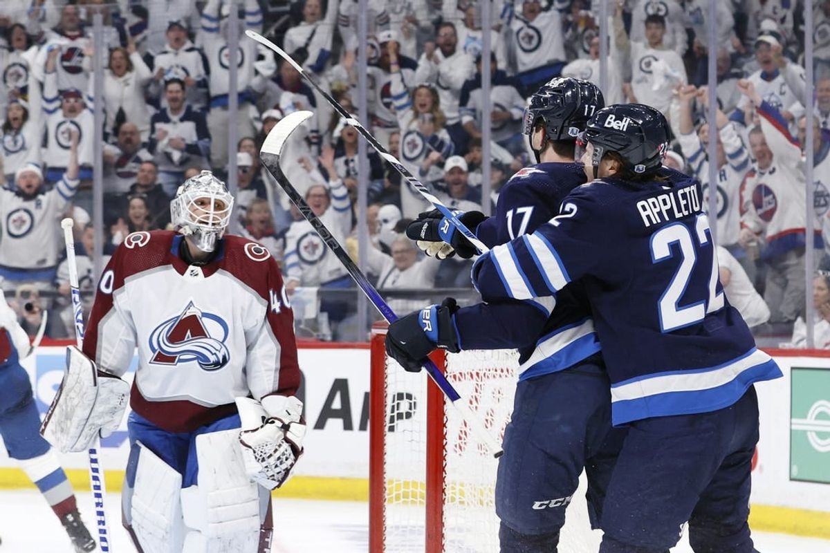 Apr 21, 2024; Winnipeg, Manitoba, CAN; Winnipeg Jets center Mason Appleton (22) celebrates the second period goal by Winnipeg Jets center Adam Lowry (17) on Colorado Avalanche goaltender Alexandar Georgiev (40) in game one of the first round of the 2024 Stanley Cup Playoffs at Canada Life Centre.