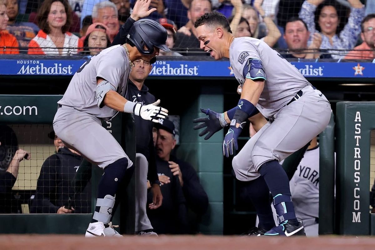 Mar 30, 2024; Houston, Texas, USA; New York Yankees third baseman Oswaldo Cabrera (95) celebrates with New York Yankees designated hitter Aaron Judge (99, right) after hitting a two-run home run to right field against the Houston Astros during the seventh inning at Minute Maid Park.