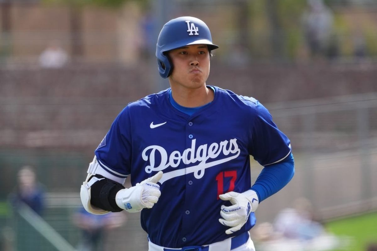 Feb 27, 2024; Phoenix, Arizona, USA; Los Angeles Dodgers designated hitter Shohei Ohtani (17) returns to the dugout after grounding into a double play during the third inning against the Chicago White Sox at Camelback Ranch-Glendale.