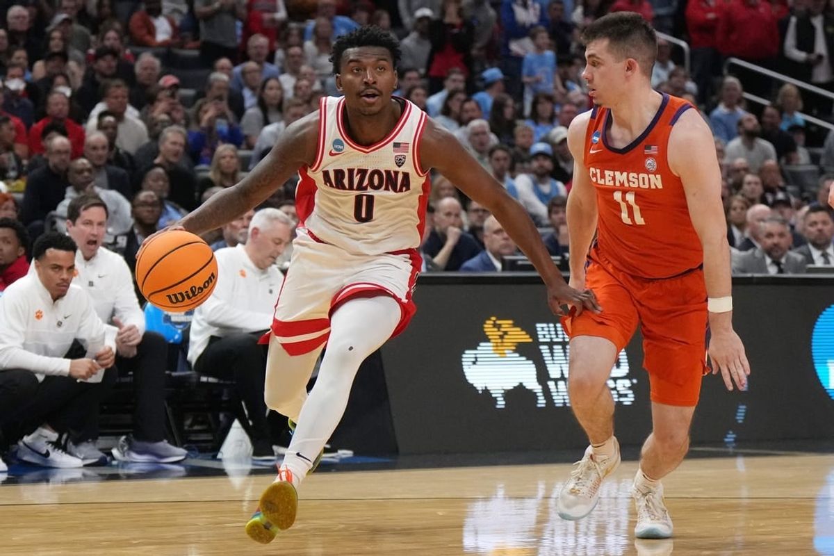 Mar 28, 2024; Los Angeles, CA, USA; Arizona Wildcats guard Jaden Bradley (0) controls the ball against Clemson Tigers guard Joseph Girard III (11) in the first half in the semifinals of the West Regional of the 2024 NCAA Tournament at Crypto.com Arena.