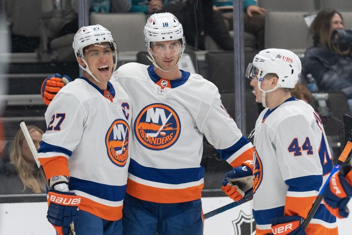 Mar 7, 2024; San Jose, California, USA; New York Islanders left wing Anders Lee (27) , left wing Pierre Engvall (18) and center Jean-Gabriel Pageau (44) celebrate during the third period against the San Jose Sharks at SAP Center at San Jose.