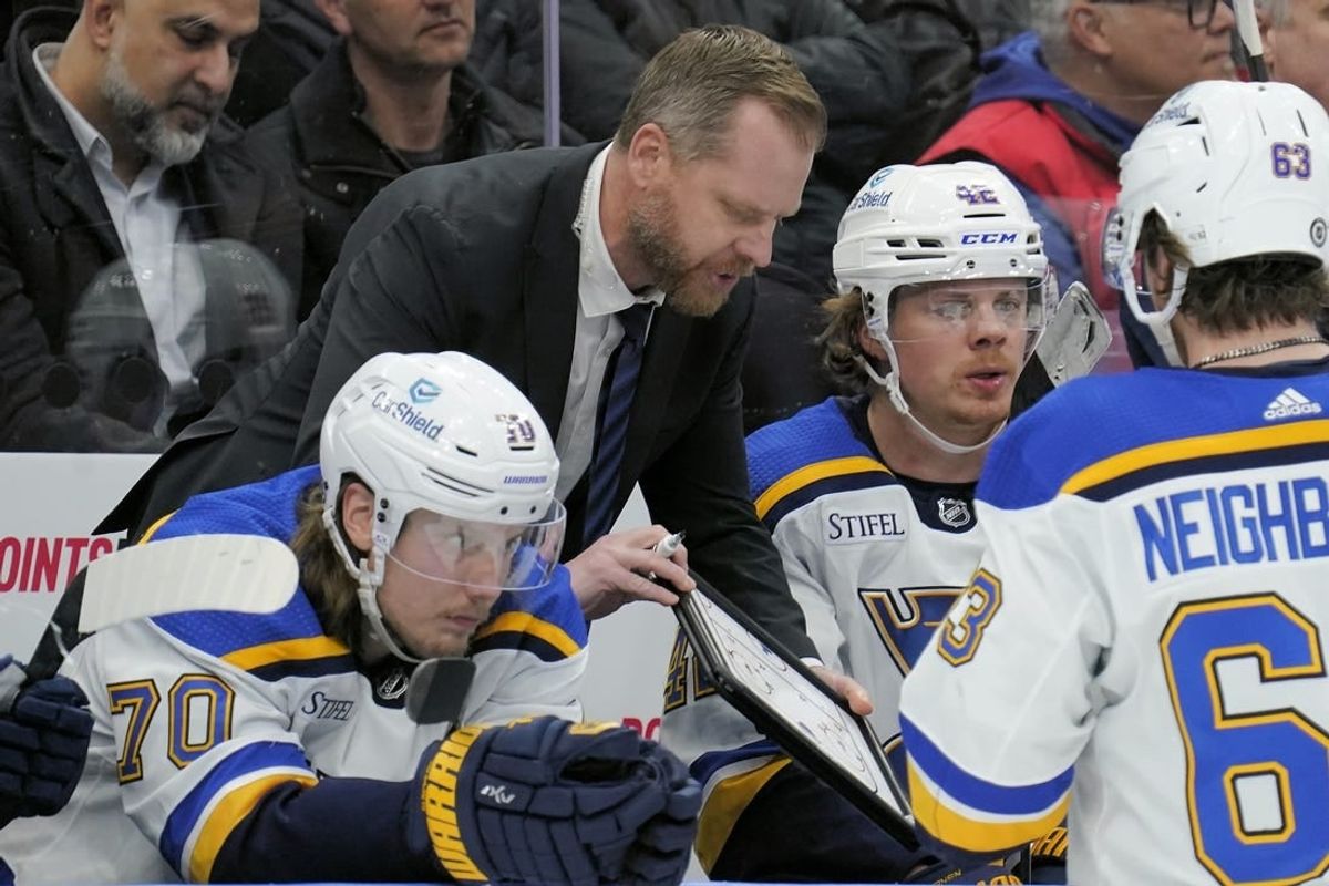 Feb 13, 2024; Toronto, Ontario, CAN; St. Louis Blues head coach Drew Bannister explains a play to his players during a break in the action against the Toronto Maple Leafs during the third period Scotiabank Arena.
