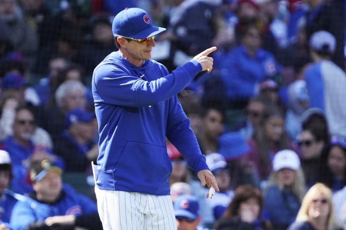 Apr 21, 2024; Chicago, Illinois, USA; Chicago Cubs manager Craig Counsell (30) makes a pitching change against the Miami Marlins during the seventh inning at Wrigley Field.