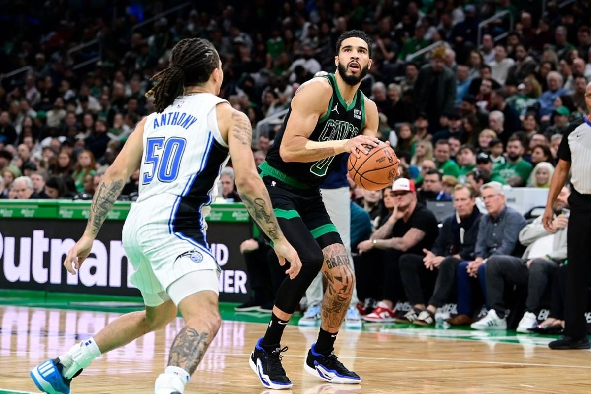 Dec 15, 2023; Boston, Massachusetts, USA; Boston Celtics forward Jayson Tatum (0) shoots the ball during the second half against the Orlando Magic at TD Garden.