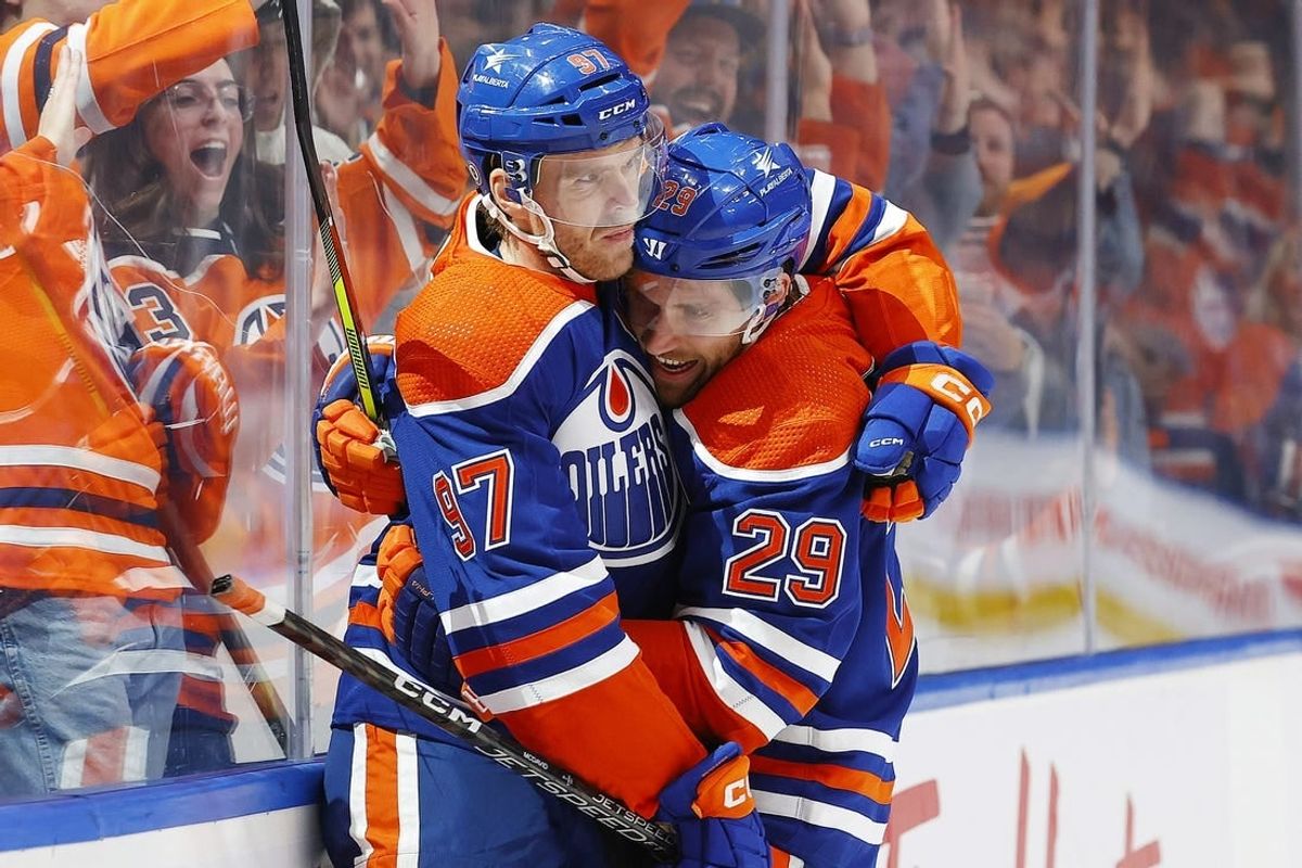 Nov 13, 2023; Edmonton, Alberta, CAN; Edmonton Oilers forward Connor McDavid (97) celebrates his goal with center Leon Draisaitl (29) during the third period against the New York Islanders at Rogers Place.