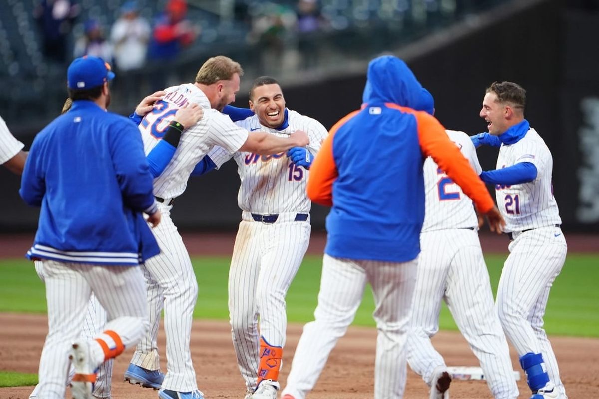 Apr 4, 2024; New York City, New York, USA; New York Mets first baseman Pete Alonso (20) congratulates New York Mets left fielder Tyrone Taylor (15) for the winning hit as he grabs his jersey during the ninth inning against the Detroit Tigers at Citi Field.
