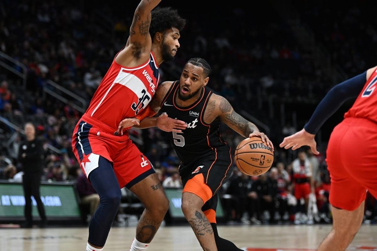 Jan 27, 2024; Detroit, Michigan, USA; Detroit Pistons guard Monte Morris (5) drives to the basket against Washington Wizards forward Marvin Bagley III (35) in the first quarter at Little Caesars Arena.