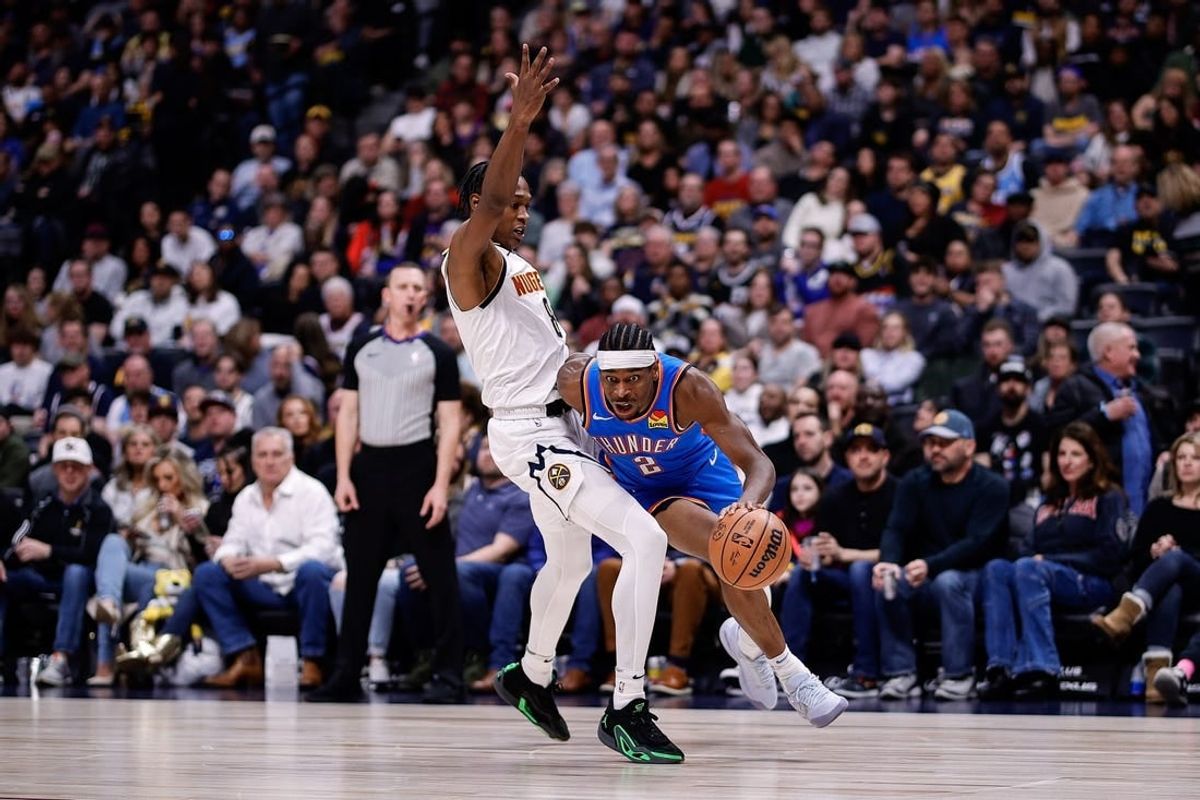 Dec 29, 2023; Denver, Colorado, USA; Oklahoma City Thunder guard Shai Gilgeous-Alexander (2) drives to the basket against Denver Nuggets forward Peyton Watson (8) in the second quarter at Ball Arena.