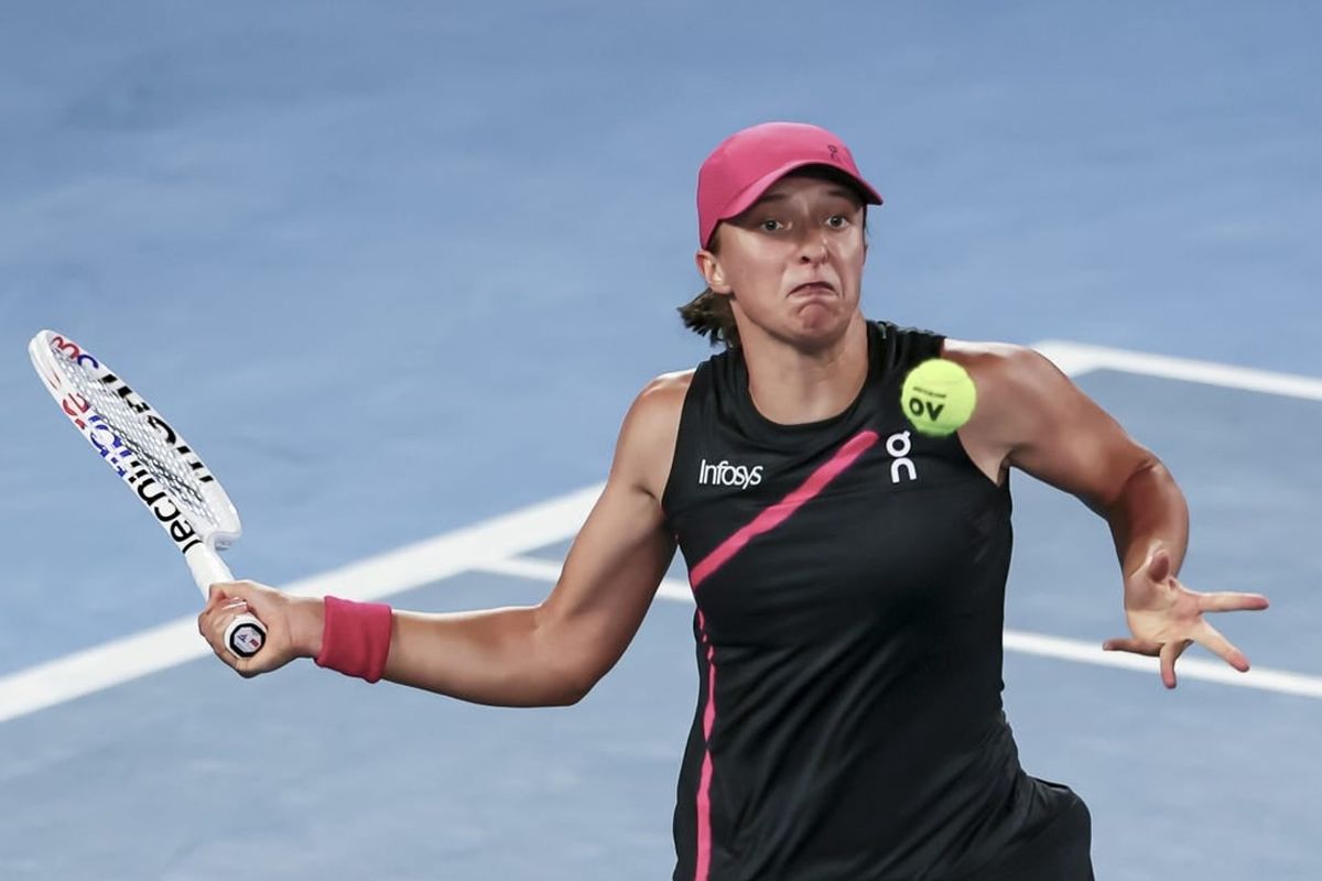 Jan 20, 2024; Melbourne, Victoria, Australia; Iga Swiatek of Poland plays a shot against Linda Noskova (not pictured) of Czechia in Round 3 of the Women's Singles on Day 7 of the Australian Open tennis at Rod Laver Arena.