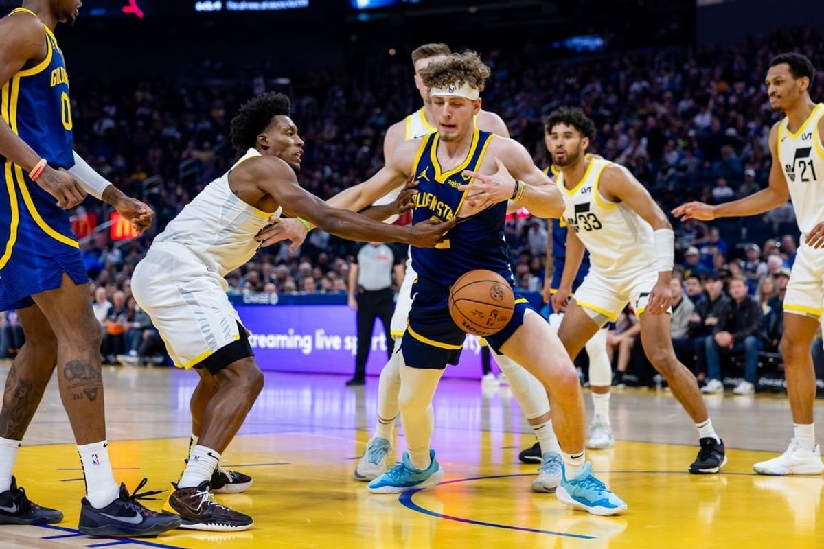 Apr 7, 2024; San Francisco, California, USA;  Golden State Warriors forward Moses Moody (4) is stripped of the ball during the second quarter against the Utah Jazz at Chase Center.