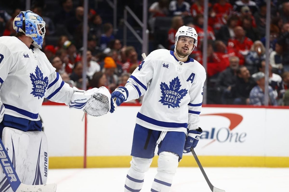 Mar 20, 2024; Washington, District of Columbia, USA; Toronto Maple Leafs center Auston Matthews (34) celebrates with Toronto Maple Leafs goaltender Joseph Woll (60) after a goal against the Washington Capitals during the third period at Capital One Arena.