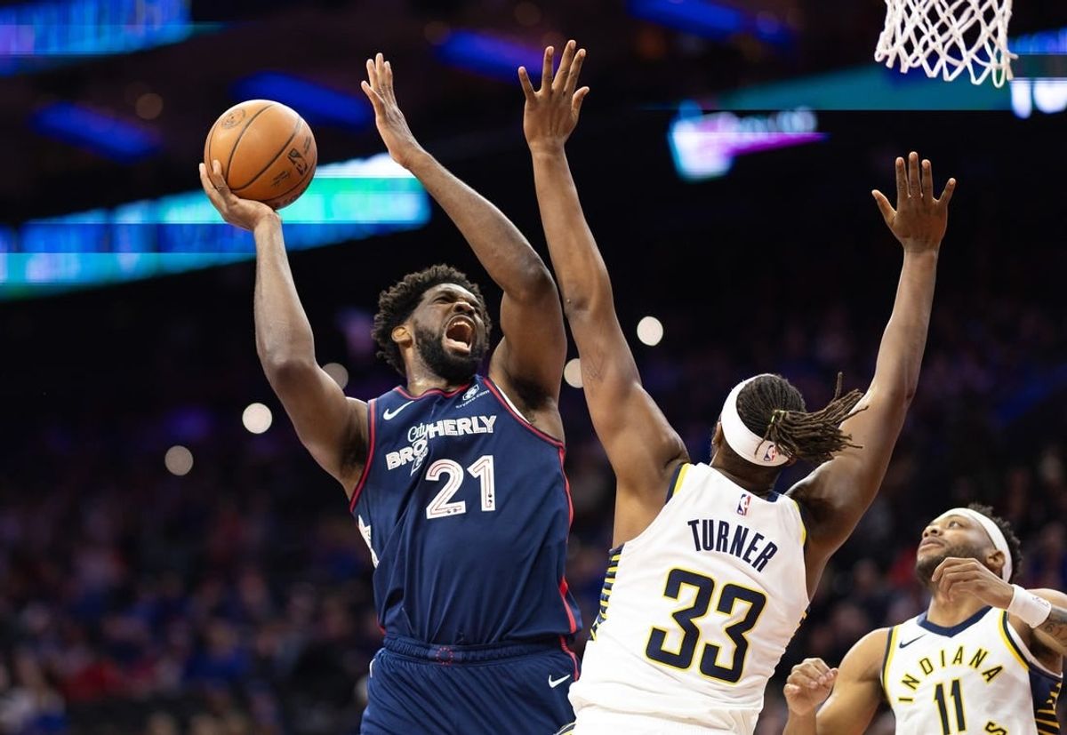 Nov 14, 2023; Philadelphia, Pennsylvania, USA; Philadelphia 76ers center Joel Embiid (21) drives for a shot against Indiana Pacers center Myles Turner (33) during the first quarter at Wells Fargo Center.