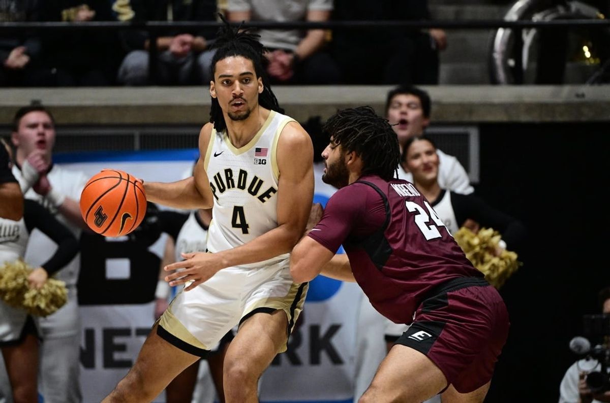 Dec 29, 2023; West Lafayette, Indiana, USA; Purdue Boilermakers forward Trey Kaufman-Renn (4) leans into Eastern Kentucky Colonels forward Michael Moreno (24) during the first half at Mackey Arena.