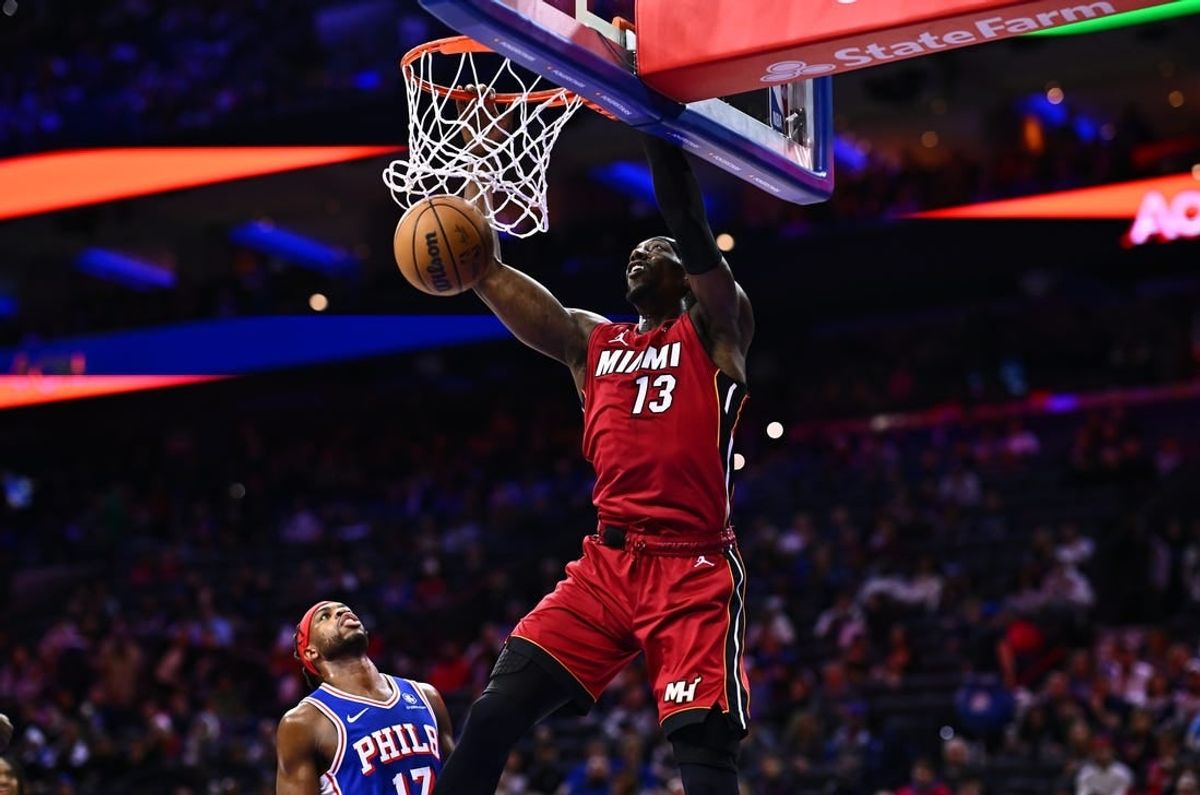 Feb 14, 2024; Philadelphia, Pennsylvania, USA; Miami Heat center Bam Adebayo (13) dunks against the Philadelphia 76ers in the first quarter at Wells Fargo Center.