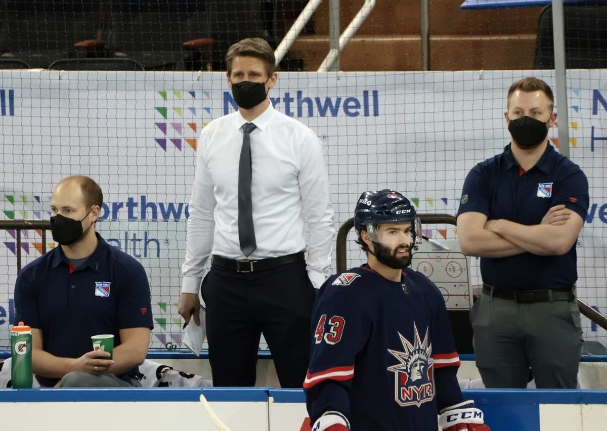 Mar 17, 2021; New York, New York, USA; Handling coaching duties for the New York Rangers against the Philadelphia Flyers are Hartford Wolf Pack head coach Kris Knoblauch (seen here watching warm-ups) and Wolf Pack associate head coach Gord Murphy and Rangers associate general manager Chris Drury at Madison Square Garden. Due to the NHL COVID-10 protocol, the Rangers coaching staff were not available for tonights game.