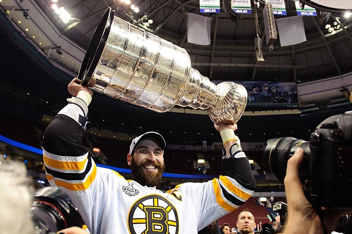 June 15, 2011; Vancouver, BC, CANADA;  Boston Bruins defenseman Zdeno Chara (33) raises the Stanley Cup after defeating the Vancouver Canucks 4-0 in game seven of the 2011 Stanley Cup finals at Rogers Arena. Mandatory Credit: Anne-Marie Sorvin-Imagn Images