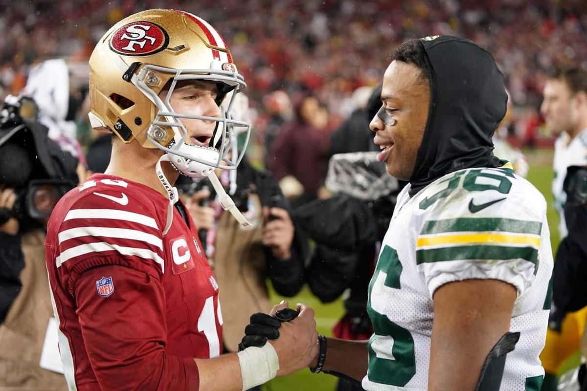 January 20, 2024; Santa Clara, CA, USA; Green Bay Packers safety Anthony Johnson Jr. (36) and San Francisco 49ers quarterback Brock Purdy (13) shake hands after the 2024 NFC divisional round game at Levi's Stadium.