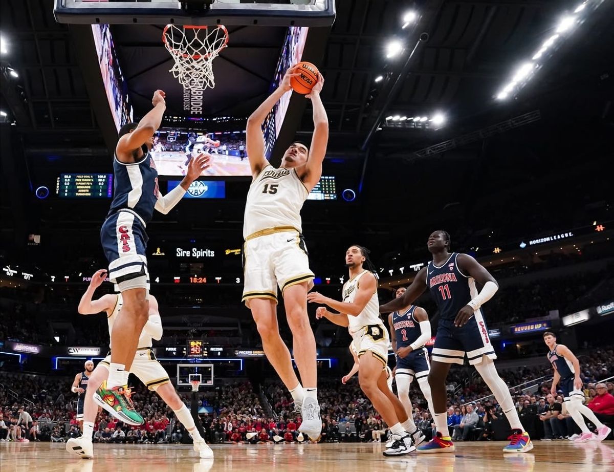 Dec 16, 2023; Indianapolis, Indiana, USA;  Purdue Boilermakers center Zach Edey (15) rebounds the ball against Arizona Wildcats forward Keshad Johnson (16) during the first half at Gainbridge Fieldhouse.